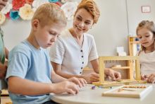 engaged-children-learning-with-teacher-in-classroo-2026-03-25-10-48-51-utc
